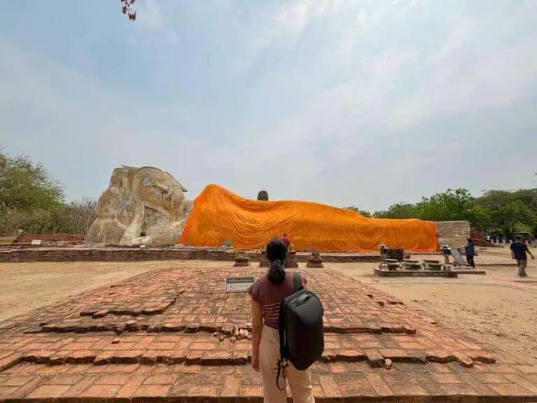 huge statue of reclining buddha at wat lokkayasutha in ayutthaya