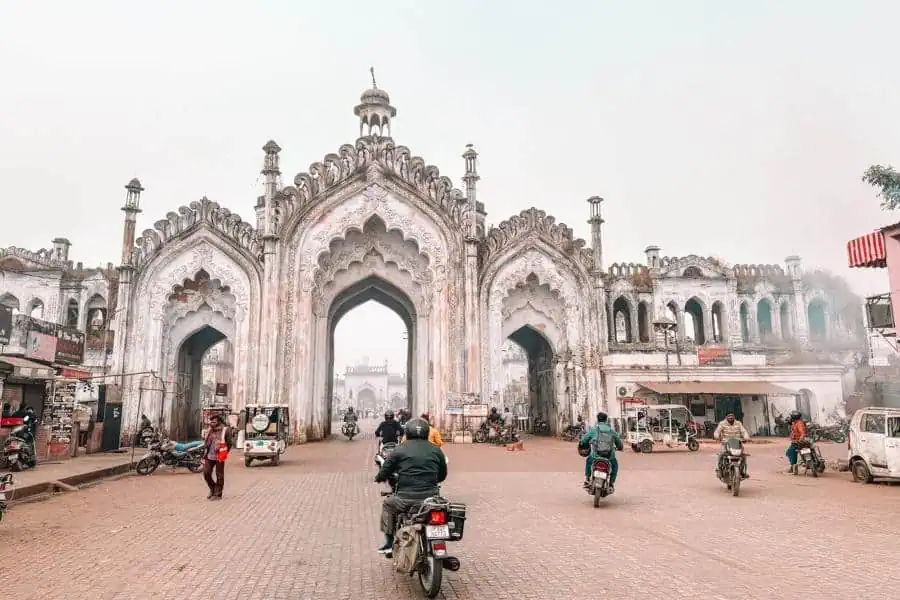 akbari gate chowk in hussainabad with motorbikes, autos, and everyday street life, lucknow