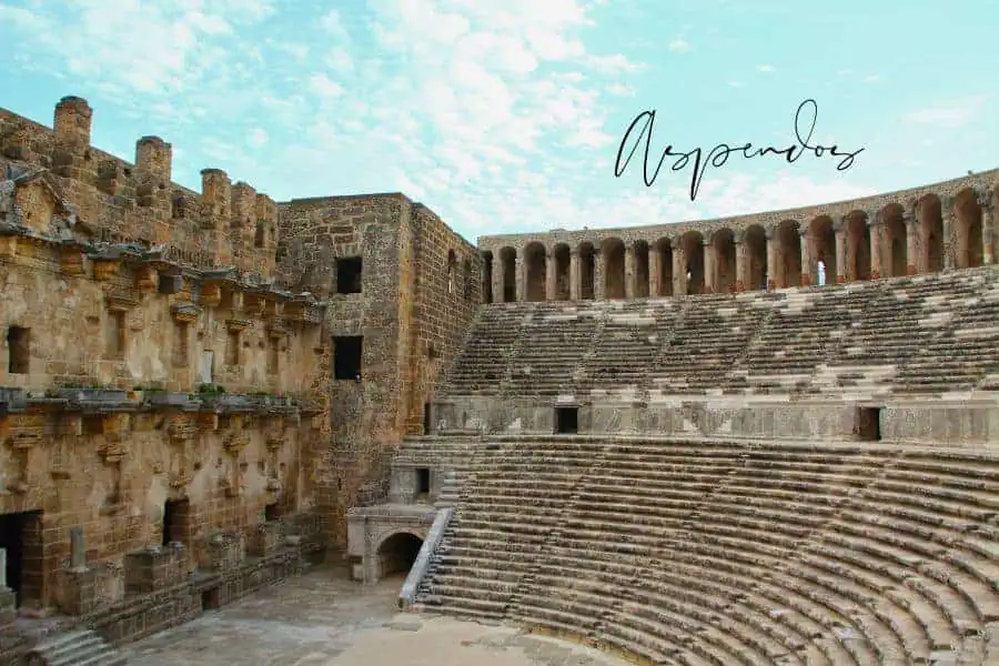  - The grand ancient Roman theater of Aspendos, Turkey, showcasing its well-preserved stone seating and architectural details under a bright sky