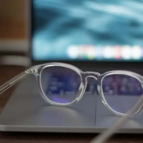 blue light computer clear glasses lying on a laptop