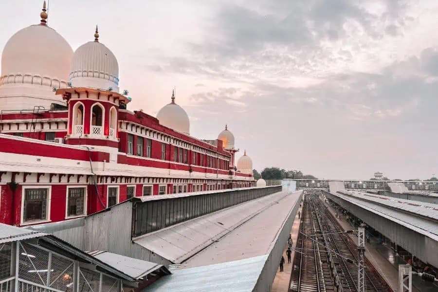 charbagh railway station with red-and-white facade and railway platforms, lucknow