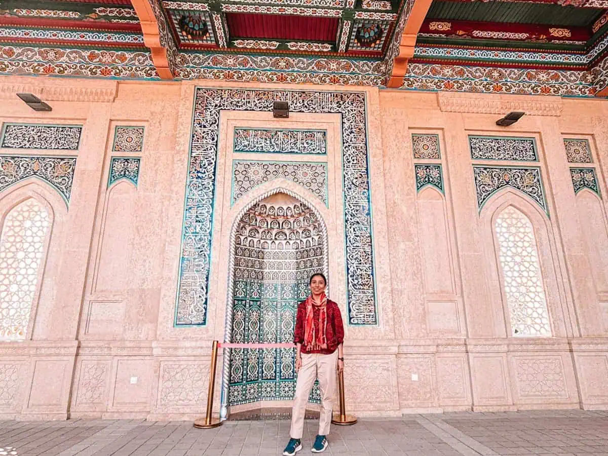 anjali Faraway Notes author in front of ornate turquoise tilework at hazrat khizr mosque in samarkand