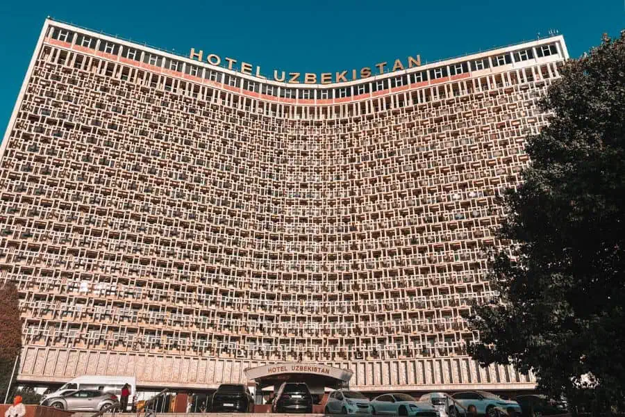 exterior of hotel uzbekistan in tashkent showing its iconic curved soviet-era facade