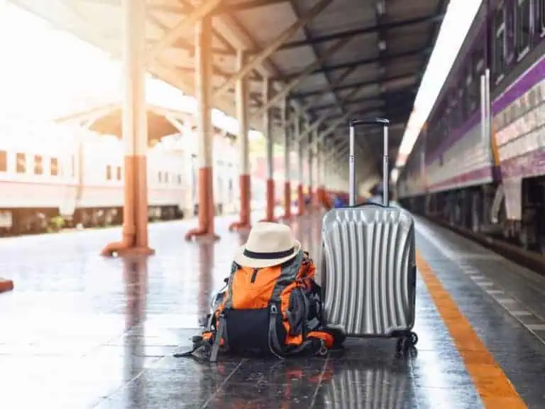 travel luggage and backpack on a chiang mai train station platform, highlighting the end of a family journey from bangkok to chiang mai