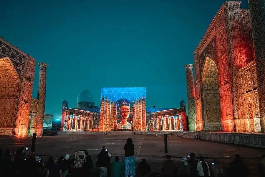 registan square at night during light and sound show in samarkand