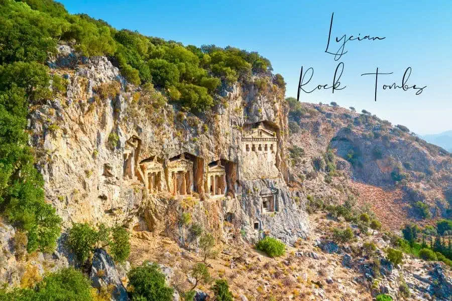 the impressive lycian rock tombs carved into the cliffs of dalyan, turkey, standing as remnants of an ancient civilization
