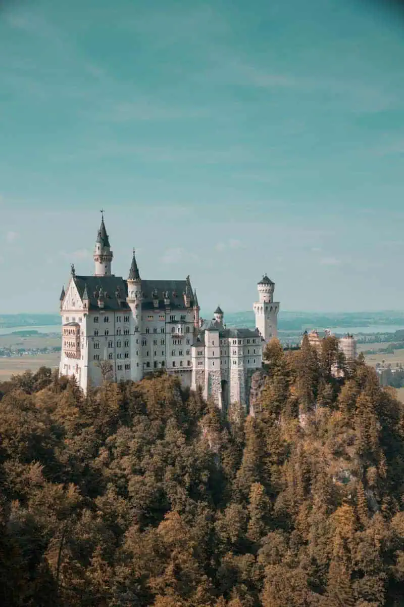 fairy tale neuschwanstein castle perched on a forested hilltop in bavaria, germany