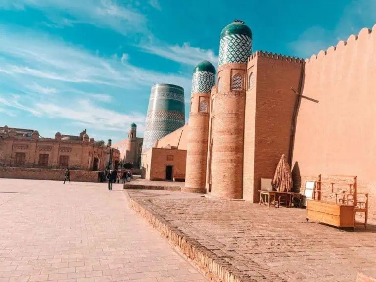 khiva old town itchan kala with kalta minor and clay walls under blue sky