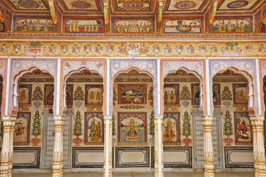 painted arches and frescoed walls inside podar haveli in nawalgarh shekhawati rajasthan