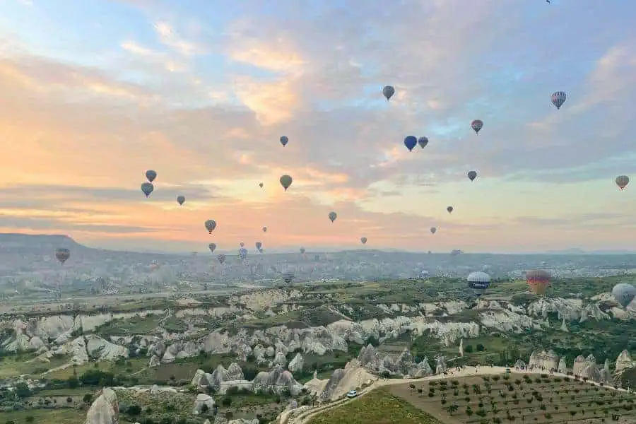 sky filled with hot air balloons in cappadocia