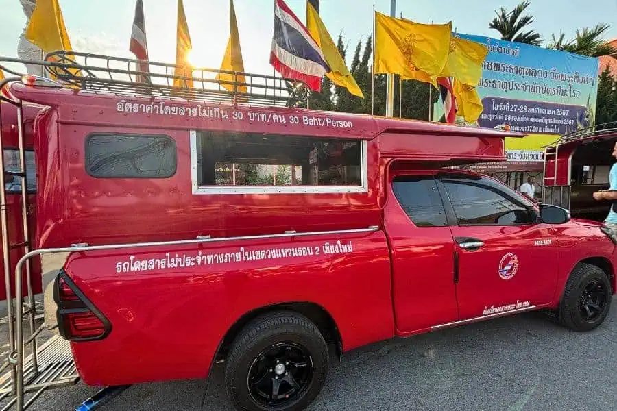 songthaew or red truck or rod daeng outside wat phra singh in chiang mai