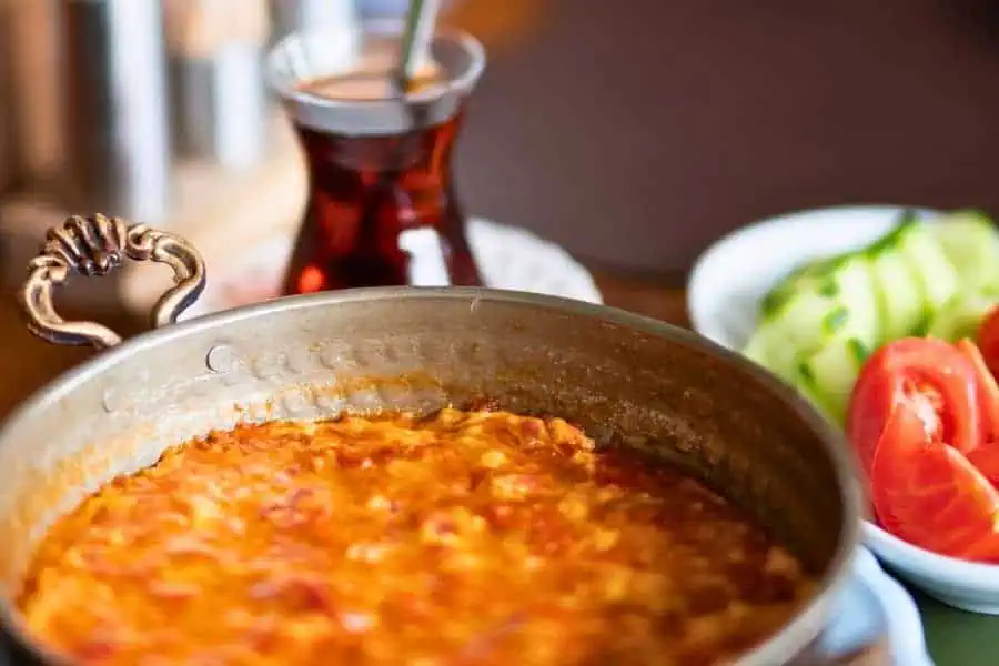 traditional turkish breakfast dish menemen scrambled eggs with tea or çay