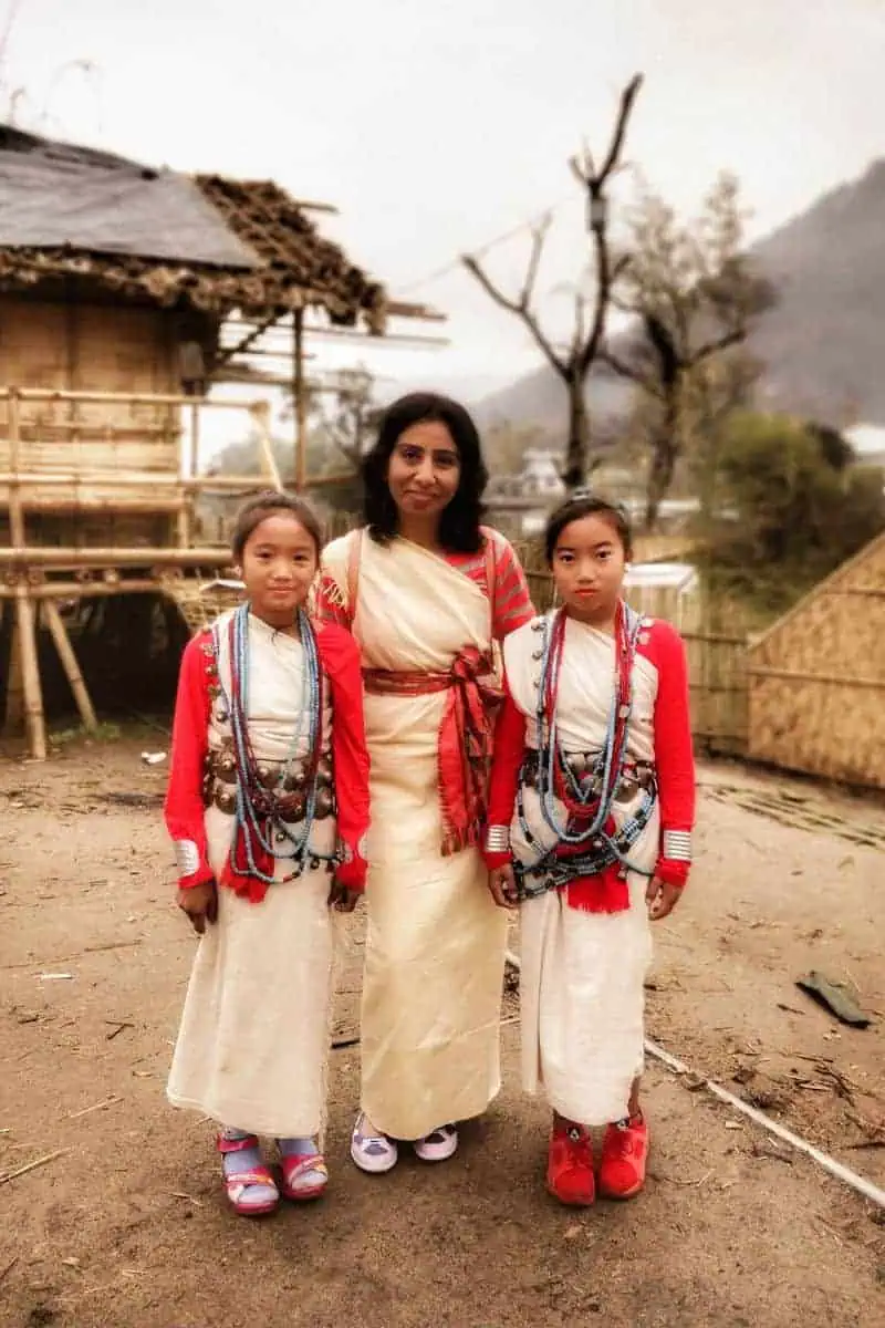 Faraway Notes blogger anjali wearing traditional tribal outfit with nyishi tribe in arunachal pradesh