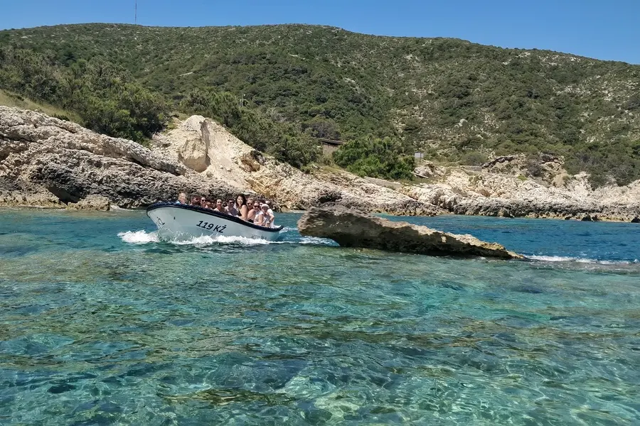 A boat from Mezuporat taking travelers to the Blue Cave