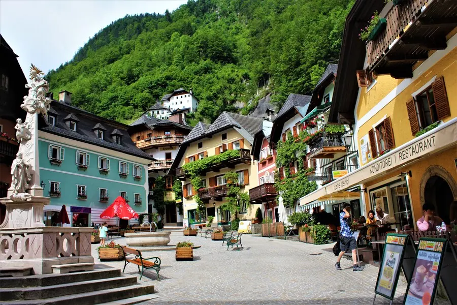 old town market square hallstatt austria holy trinity statue