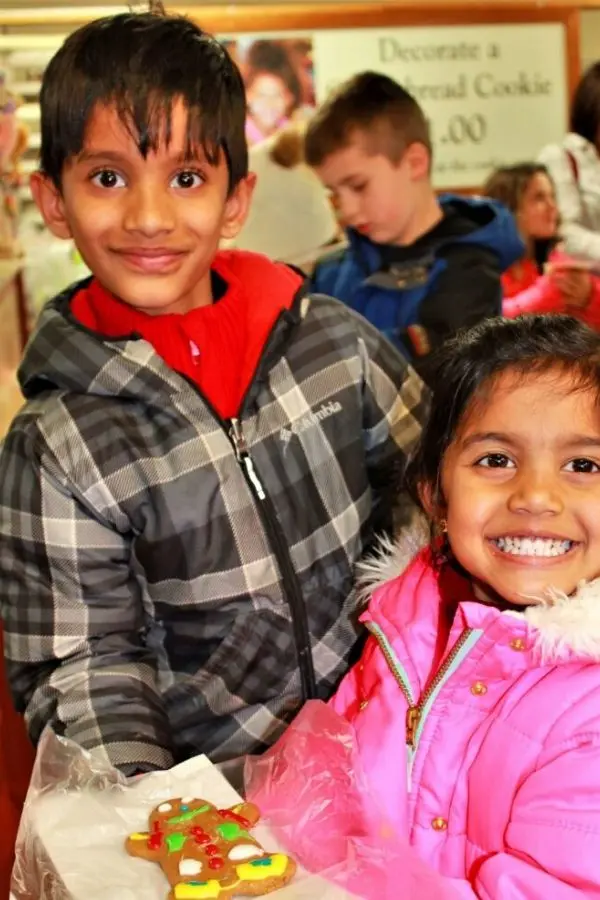 Kids happy to decorate the Gingerbread Cookies at Kitchen Kettle Village Lancaster PA