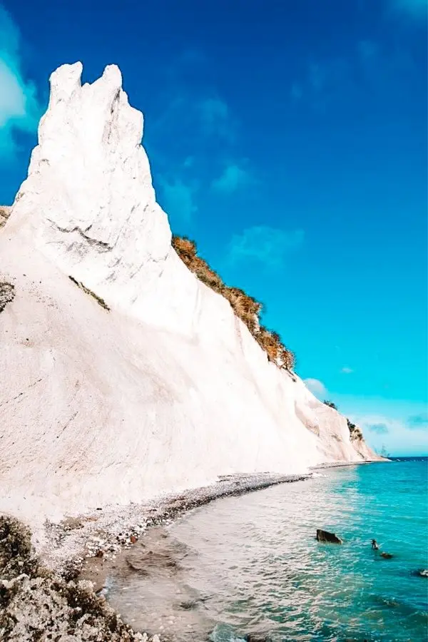 The towering white chalk cliffs of Møns Klint rising from the turquoise Baltic Sea — one of the most dramatic natural sights on a Denmark itinerary