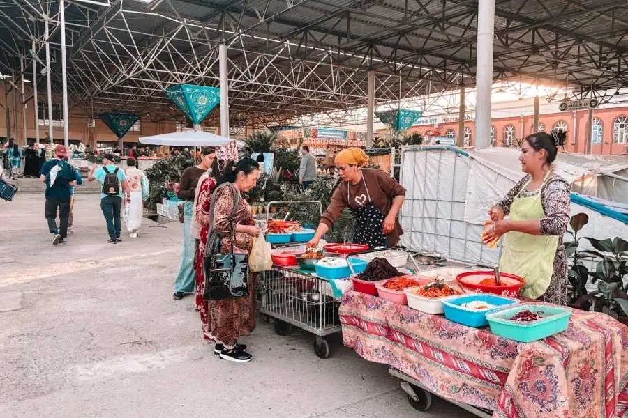 vendors selling colorful pickles and salads inside siyob bazaar