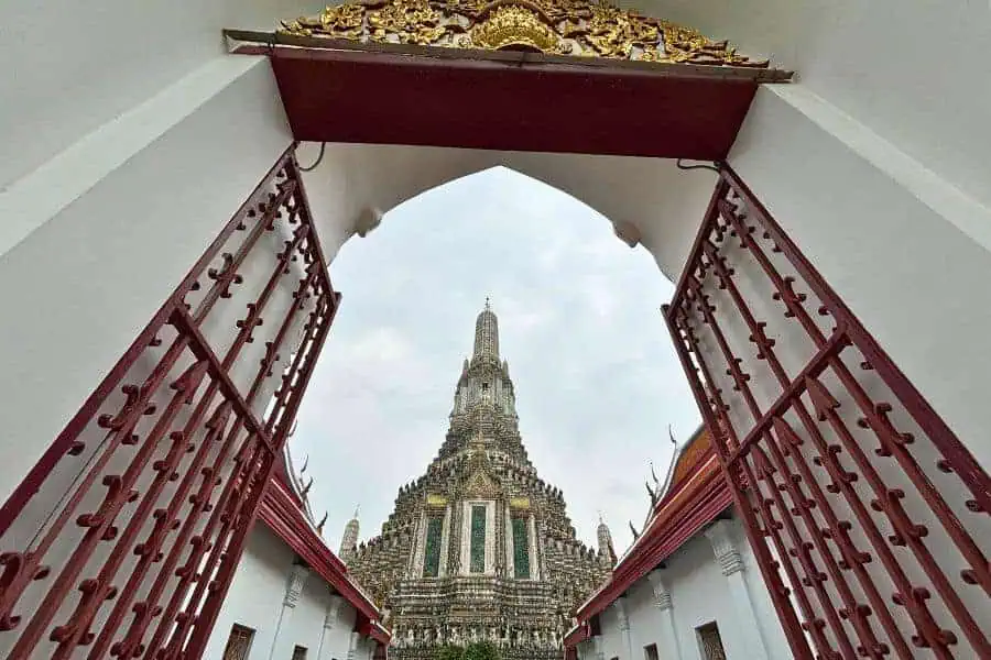 stunning view of wat arun temple on the banks of chao phraya river, an iconic stop on any Thailand itinerary