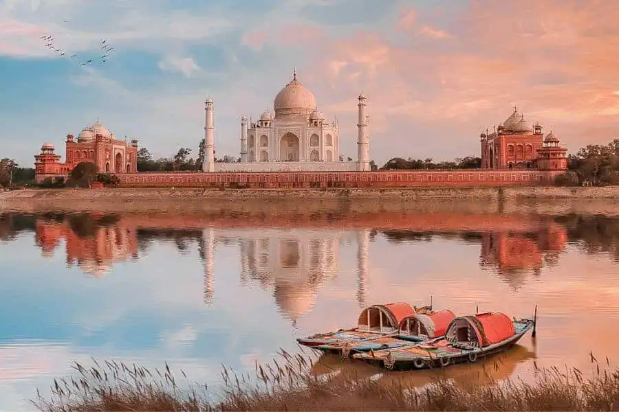 yamuna river boat ride with a view of taj mahal during a sunset or sunrise